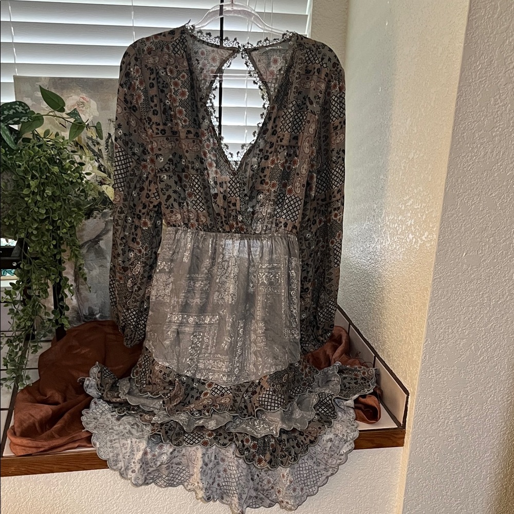 Boho dress by Blue b. with laced detail and open back & high-low cut.